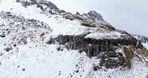 Aerial drone view of Portavescovo covered in snow, in Arabba, Italy - Starpik Stock