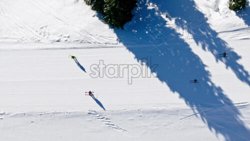 Aerial drone view of a ski resort in Col dei Baldi, Alleghe, in the Dolomites, Italy in daylight - Starpik Stock