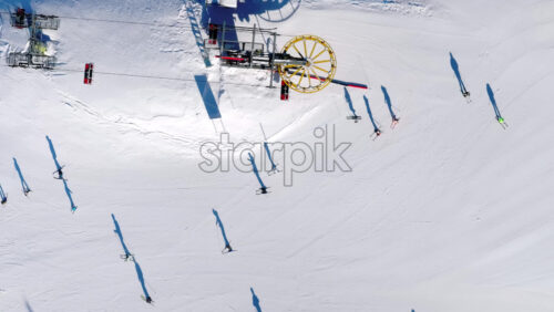Aerial drone view of a ski resort in Col dei Baldi, Alleghe, in the Dolomites, Italy in daylight - Starpik Stock