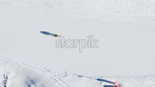 Aerial drone view of a ski resort in Col dei Baldi, Alleghe, in the Dolomites, Italy in daylight - Starpik Stock