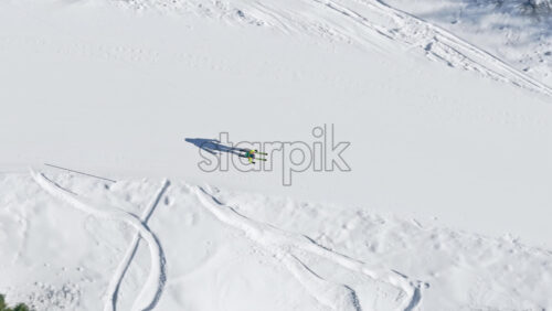 Aerial drone view of a ski resort in Col dei Baldi, Alleghe, in the Dolomites, Italy in daylight - Starpik Stock