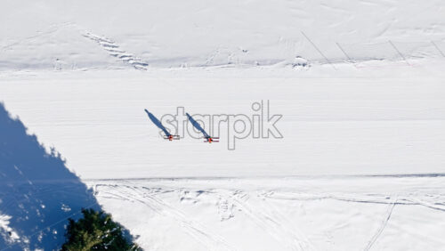Aerial drone view of a ski resort in Col dei Baldi, Alleghe, in the Dolomites, Italy in daylight - Starpik Stock
