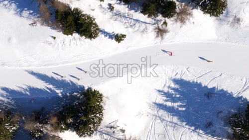 Aerial drone view of a ski resort in Col dei Baldi, Alleghe, in the Dolomites, Italy in daylight - Starpik Stock