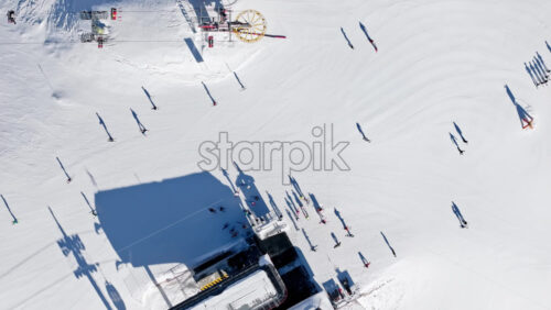 Aerial drone view of a ski resort in Col dei Baldi, Alleghe, in the Dolomites, Italy in daylight - Starpik Stock