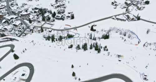 Aerial drone view of a ski resort in Corvara, in South Tyrol, the Dolomites - Starpik Stock