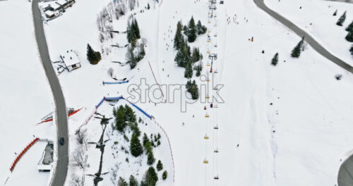 Aerial drone view of a ski resort in Corvara, in South Tyrol, the Dolomites - Starpik Stock