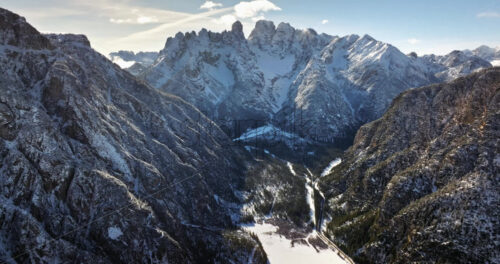 Aerial drone view of snow on the Cristallo mountain, in the Dolomites, Italy - Starpik Stock
