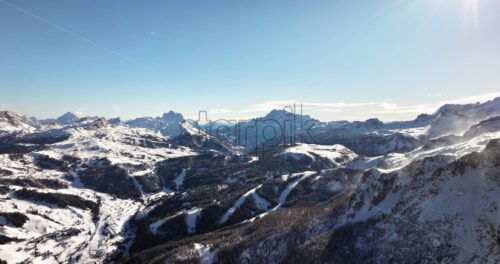 Aerial drone view of snow on the mountains in the Dolomites, Italy - Starpik Stock