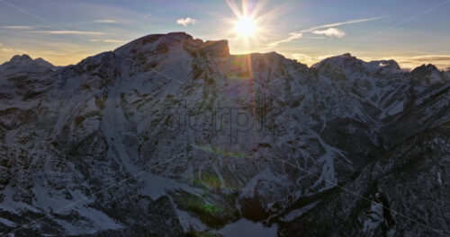 Aerial drone view of snow on the mountains in the Dolomites, Italy - Starpik Stock