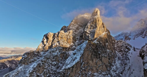 Aerial drone view of snow on the mountains in the Dolomites, Italy - Starpik Stock