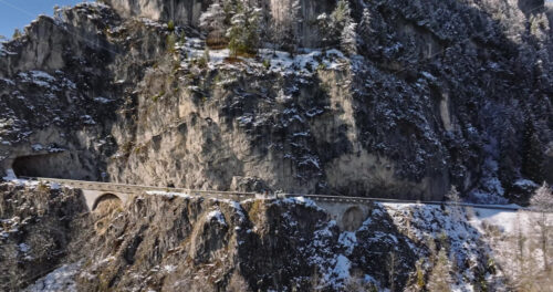 Aerial drone view of snow on the mountains in the Dolomites, Italy - Starpik Stock