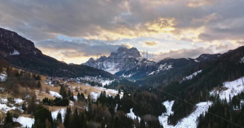 Aerial drone view of snow on the mountains in the Dolomites, Italy - Starpik Stock