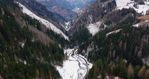 Aerial drone view of snow on the mountains in the Dolomites, Italy - Starpik Stock