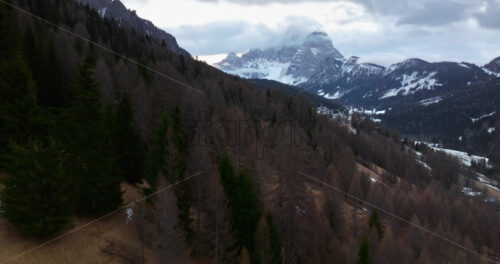 Aerial drone view of snow on the mountains in the Dolomites, Italy - Starpik Stock
