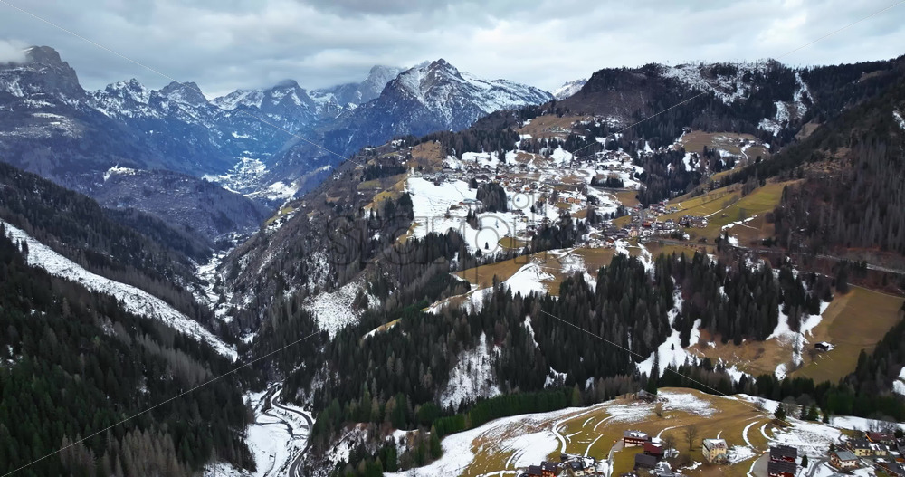 Aerial drone view of snow on the mountains in the Dolomites, Italy - Starpik Stock