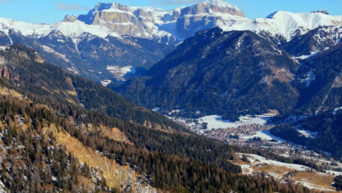 Aerial drone view of snow on the mountains in the Dolomites, Italy - Starpik Stock