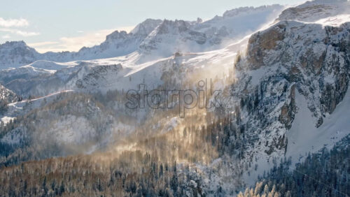 Aerial drone view of snow on the mountains in the Dolomites, Italy - Starpik Stock