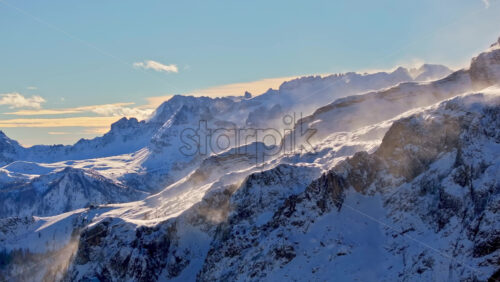 Aerial drone view of snow on the mountains in the Dolomites, Italy - Starpik Stock