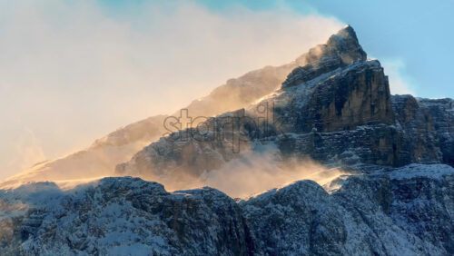Aerial drone view of snow on the mountains in the Dolomites, Italy - Starpik Stock