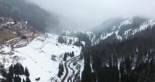 Aerial drone view of the Arabba mountain village in the Dolomites, Italy - Starpik Stock
