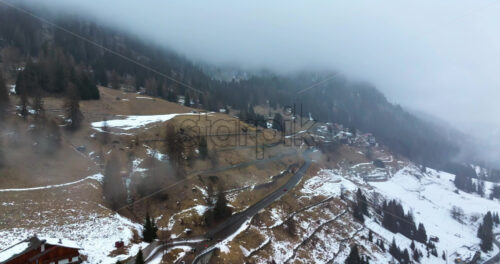 Aerial drone view of the Arabba mountain village in the Dolomites, Italy - Starpik Stock