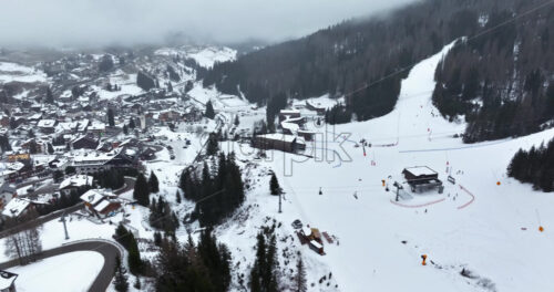 Aerial drone view of the Arabba ski resort in the Dolomites, Italy - Starpik Stock