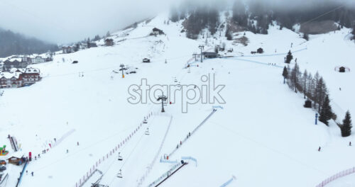 Aerial drone view of the Arabba ski resort in the Dolomites, Italy - Starpik Stock