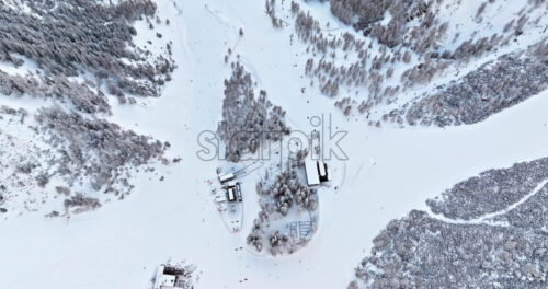 Aerial drone view of the Colfosco mountain village covered in snow, in South Tyrol, Dolomites, Northern Italy - Starpik Stock