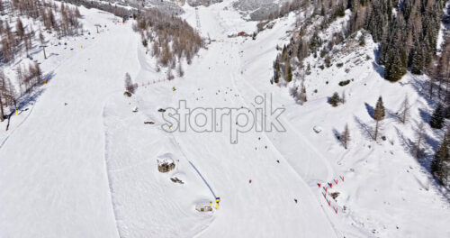 Aerial drone view of the Colfosco ski resort in South Tyrol, Dolomites, Northern Italy - Starpik Stock