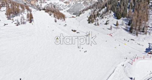Aerial drone view of the Colfosco ski resort in South Tyrol, Dolomites, Northern Italy - Starpik Stock