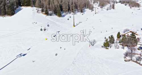 Aerial drone view of the Colfosco ski resort in South Tyrol, Dolomites, Northern Italy - Starpik Stock