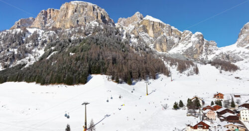 Aerial drone view of the Colfosco ski resort in South Tyrol, Dolomites, Northern Italy - Starpik Stock