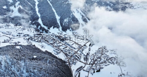 Aerial drone view of the Corvara village covered in snow, in South Tyrol, Dolomites, in northern Italy - Starpik Stock