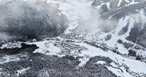 Aerial drone view of the Corvara village covered in snow, in South Tyrol, Dolomites, in northern Italy - Starpik Stock