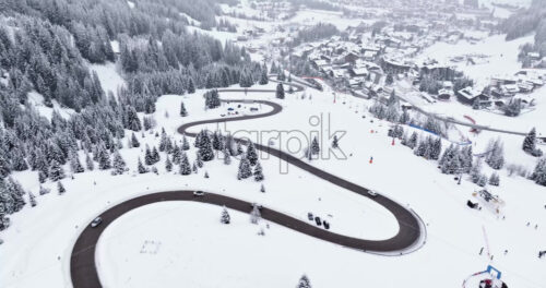 Aerial drone view of the Corvara village covered in snow, in South Tyrol, Dolomites, in northern Italy - Starpik Stock