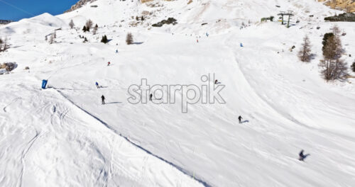 Aerial drone view of the Gardena Pass high mountain pass in the Dolomites, Italy - Starpik Stock