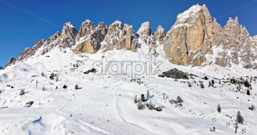 Aerial drone view of the Gardena Pass high mountain pass in the Dolomites, Italy - Starpik Stock