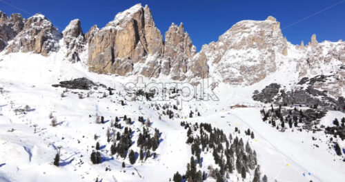 Aerial drone view of the Gardena Pass high mountain pass in the Dolomites, Italy - Starpik Stock