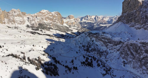 Aerial drone view of the Gardena Pass high mountain pass in the Dolomites, Italy - Starpik Stock