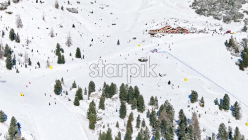 Aerial drone view of the Gardena Pass high mountain pass in the Dolomites, Italy - Starpik Stock