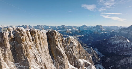 Aerial drone view of the Marmolada mountain in the Dolomites, northeastern Italy with the blue sky on the background - Starpik Stock