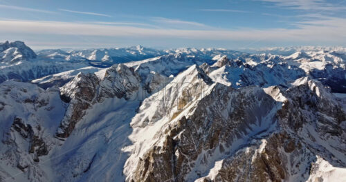 Aerial drone view of the Marmolada mountain in the Dolomites, northeastern Italy with the blue sky on the background - Starpik Stock