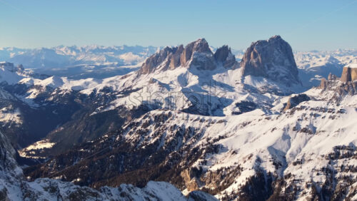 Aerial drone view of the Marmolada mountain in the Dolomites, northeastern Italy with the blue sky on the background - Starpik Stock