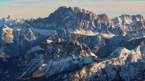 Aerial drone view of the Marmolada mountain in the Dolomites, northeastern Italy with the blue sky on the background - Starpik Stock