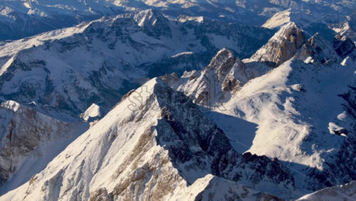 Aerial drone view of the Marmolada mountain in the Dolomites, northeastern Italy with the blue sky on the background - Starpik Stock