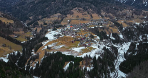 Aerial drone view of the Selva di Cadore commune surrounded by the Dolomites mountains in Italy - Starpik Stock