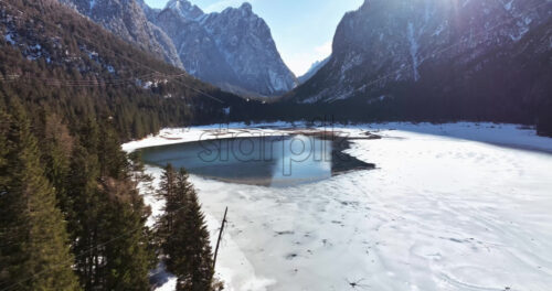 Aerial drone view of the Toblacher See lake in the municipality of Toblach in South Tyrol, Italy - Starpik Stock
