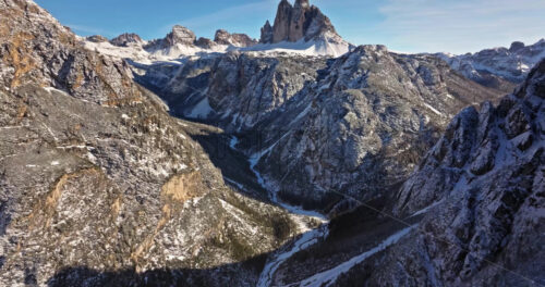 Aerial drone view of the Tre Cime di Lavaredo in the Sexten Dolomites of northeastern Italy with the blue sky on the background - Starpik Stock