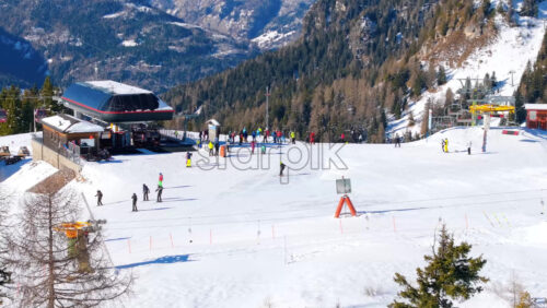 Alleghe, Italy – January 12, 2025: Aerial drone view of a ski resort in Col dei Baldi, Alleghe, in the Dolomites, Italy in daylight - Starpik Stock