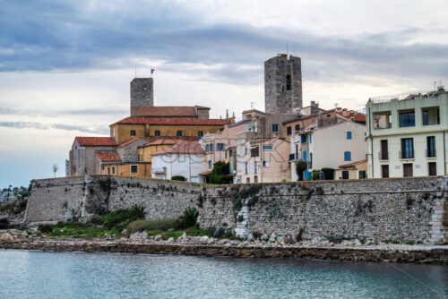 Antibes castle and central square, wall and tower by the sea - Starpik Stock